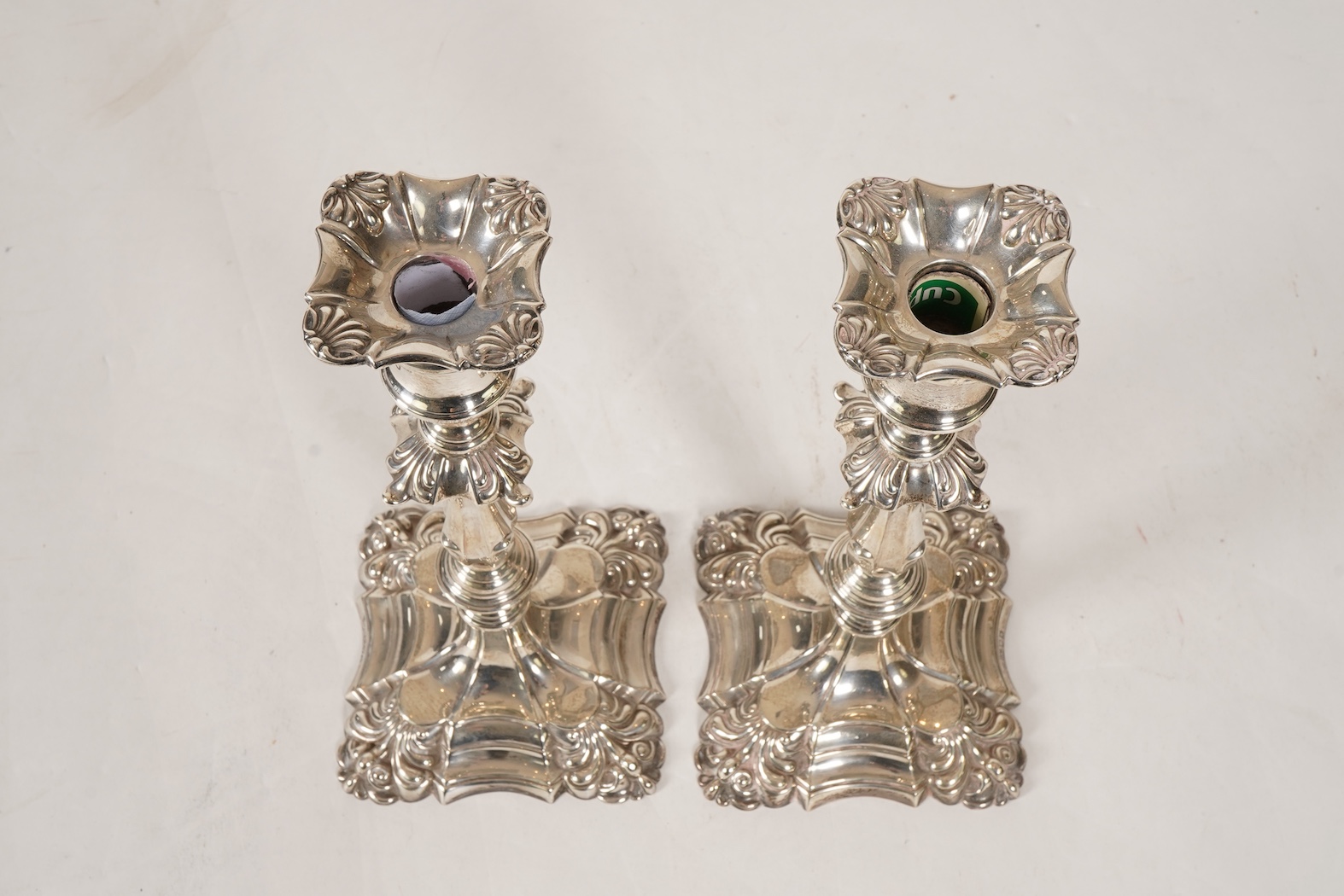 A pair of George V 18th century style silver candlesticks, by Thomas Bradbury & Sons, with removable sconces